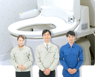 作業着を着た男女スタッフ3人 